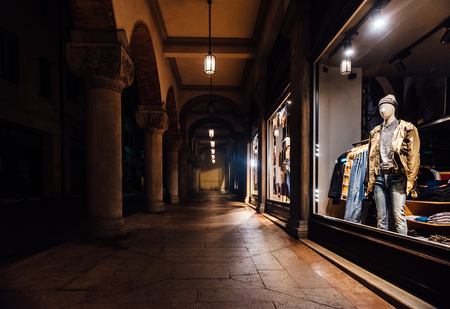 night shop window with clothes in italyのeditorial素材