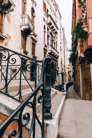 narrow streets and canals of Venice Italyの写真素材
