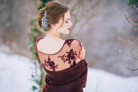 groom in a brown and bride in burgundy in the mountains Carpathiansの写真素材