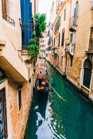 narrow streets and canals of Venice Italyの写真素材