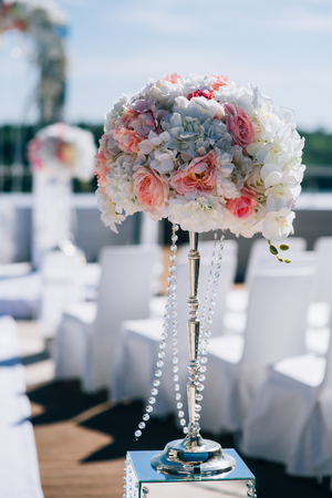 wedding decorations from flowers and a wedding arch for the ceremonyの写真素材
