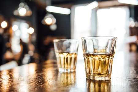 glasses of whiskey on the table in the barbershopの写真素材