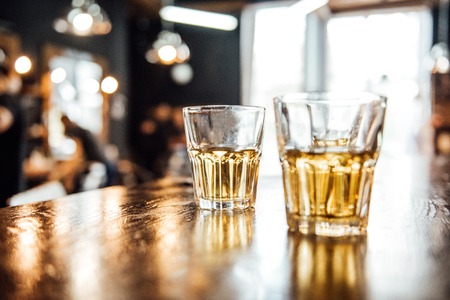 glasses of whiskey on the table in the barbershopの写真素材