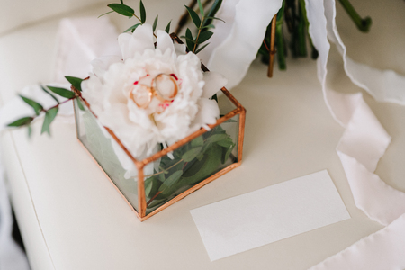 wedding rings with a wedding decorの写真素材