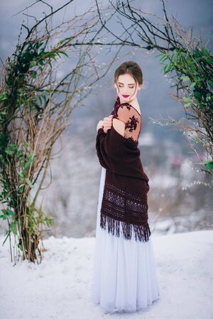 groom in a brown and bride in burgundy in the mountains Carpathiansの写真素材