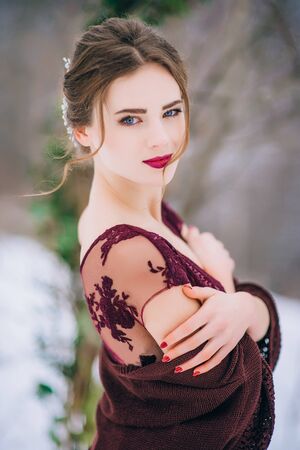 groom in a brown and bride in burgundy in the mountains Carpathiansの写真素材