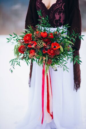 groom in a brown and bride in burgundy in the mountains Carpathiansの写真素材