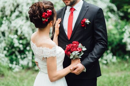 elegant wedding bouquet of fresh natural flowers and greenery