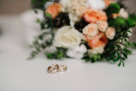 gold wedding rings as an attribute of a young couple's weddingの写真素材