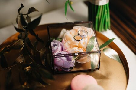 gold wedding rings as an attribute of a young couple's weddingの写真素材