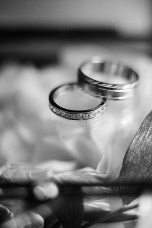 gold wedding rings as an attribute of a young couple's weddingの写真素材