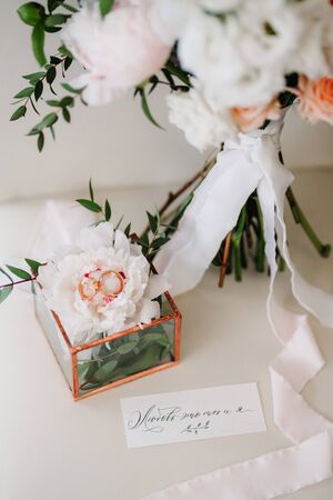 gold wedding rings as an attribute of a young couple's weddingの写真素材