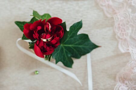 gold wedding rings as an attribute of a young couple's weddingの写真素材