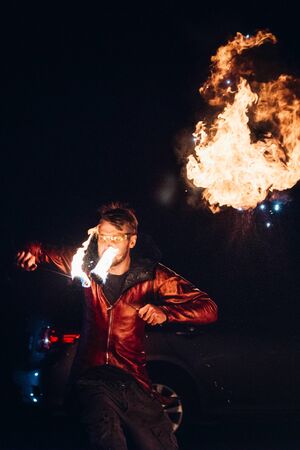 light up the night fire show with the participation of the people, light, and open fireの写真素材