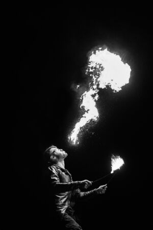 light up the night fire show with the participation of the people, light, and open fireの写真素材