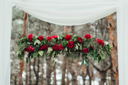 wedding ceremony in the woods among the trees on the green trackの写真素材