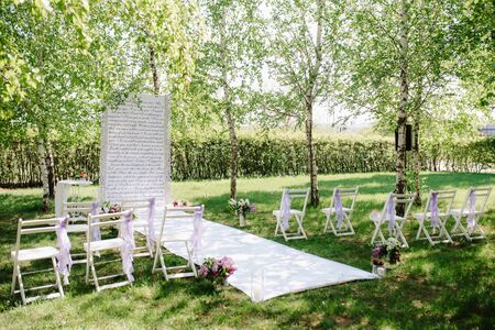 wedding ceremony in the woods among the trees on the green trackの写真素材