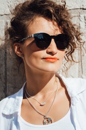 young girl walking on the old streets poland of europeの写真素材