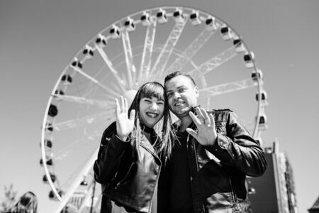 happy guy and girl walking along the tourist streets of old Europe in the city of Gdanskの写真素材