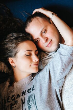 guy and girl in the house near the window overlooking a snowy landscapeの写真素材