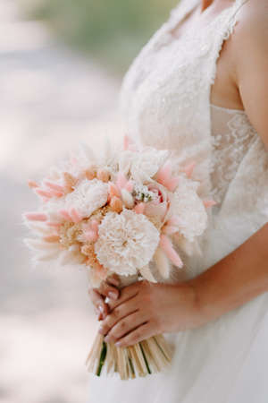 elegant wedding bouquet of fresh natural flowers and greeneryの写真素材