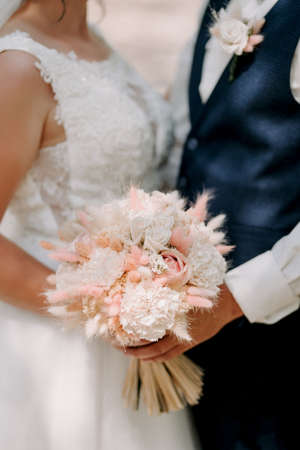 elegant wedding bouquet of fresh natural flowers and greeneryの写真素材