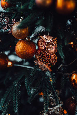 new year festive decorations in warm colors, christmas tree and christmas wreathの写真素材