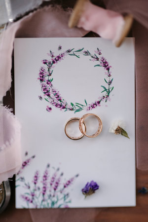 wedding rings with wedding decor of dried flowersの写真素材