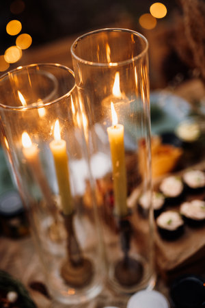 atmospheric candle decor with live fire on the banquet tableの写真素材