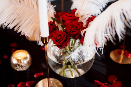 decoration of tables with burning candles, decor in shades of black, red and whiteの写真素材