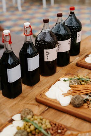 welcome buffet with alcohol and snacks, sandwiches, cupcakesの写真素材