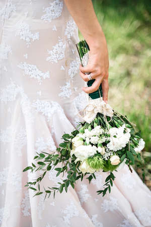 elegant wedding bouquet of fresh natural flowers and greeneryの写真素材