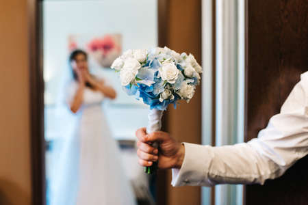 elegant wedding bouquet of fresh natural flowers and greenery