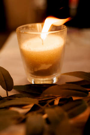 atmospheric candle decor with live fire on the banquet tableの写真素材