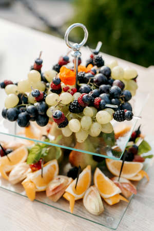 welcome buffet with alcohol and snacks, sandwiches, cupcakesの写真素材