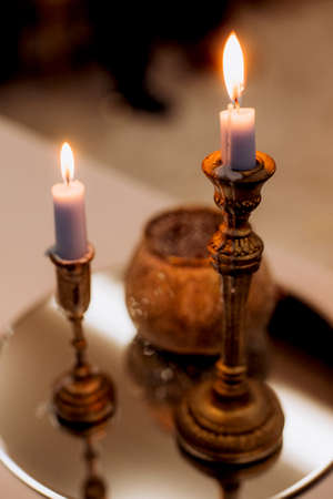 atmospheric candle decor with live fire on the banquet tableの写真素材
