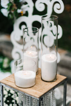 atmospheric candle decor with live fire on the banquet tableの写真素材