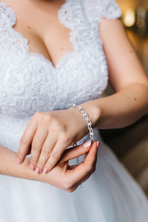 the bride wears a wedding bracelet on her left handの写真素材
