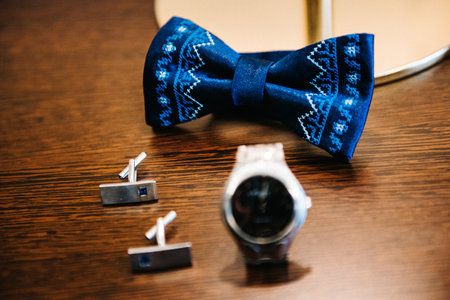wedding ring in a box and watch the groom on the tableの写真素材