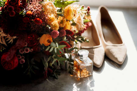 red elegant wedding bouquet of fresh natural flowers and greeneryの写真素材