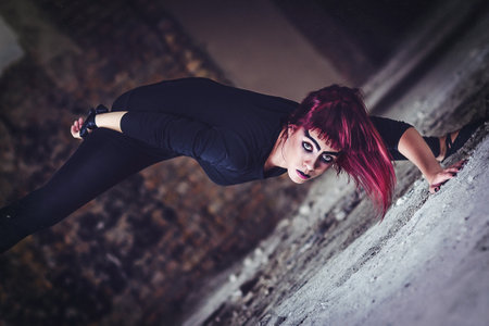 girl model in black with pink hair in an abandoned buildingの写真素材