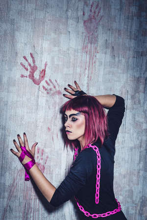 girl model in black with pink hair in an abandoned buildingの写真素材