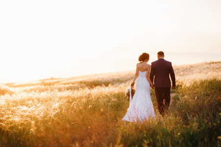 A couple in love a guy and a girl on a walk in the forest beltの写真素材