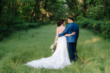 A couple in love a guy and a girl on a walk in the forest beltの写真素材