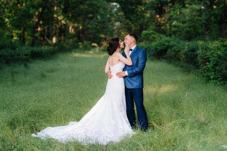 A couple in love a guy and a girl on a walk in the forest beltの写真素材