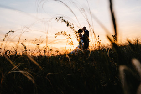 A couple in love a guy and a girl on a walk in the forest beltの写真素材