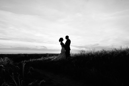 A couple in love a guy and a girl on a walk in the forest beltの写真素材