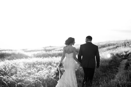 A couple in love a guy and a girl on a walk in the forest beltの写真素材