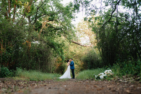 A couple in love a guy and a girl on a walk in the forest beltの写真素材