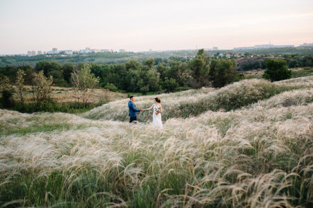 A couple in love a guy and a girl on a walk in the forest beltの写真素材